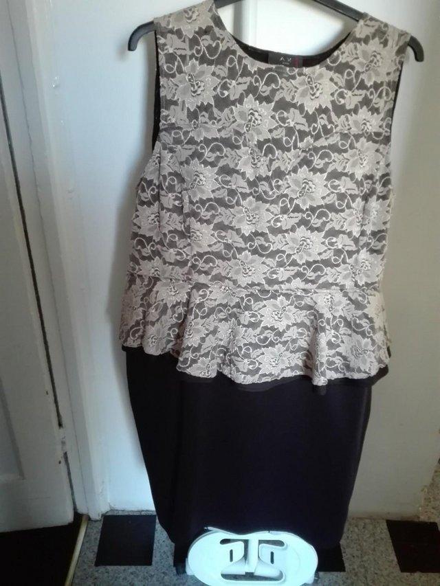 Preview of the first image of Peplum Laced Sleeveles Dress A XParis.