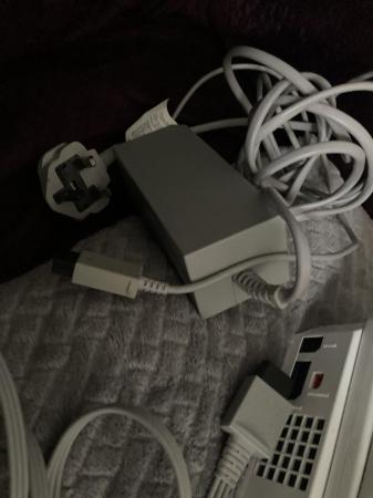 Image 1 of Wii console with games and 2 handsets
