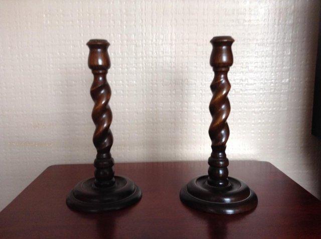 Preview of the first image of ANTIQUE WOODEN BARLEY TWIST CANDLESTICKS.