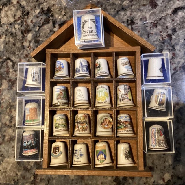 Preview of the first image of Collection of over 200 thimbles, most in wooden display case.