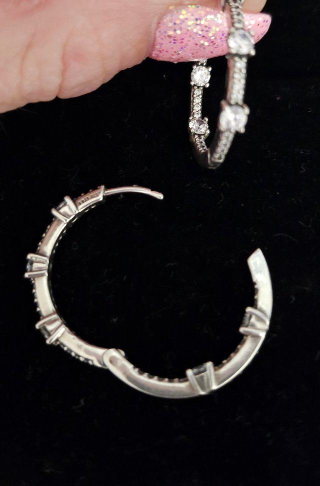 Preview of the first image of Pandora hoop earrings for women or girl.