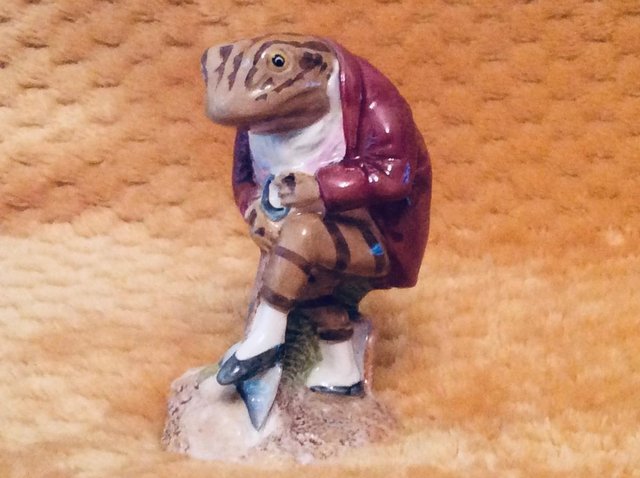 Preview of the first image of Beatrix Potter’s Jeremy Fisher Digging Figure.