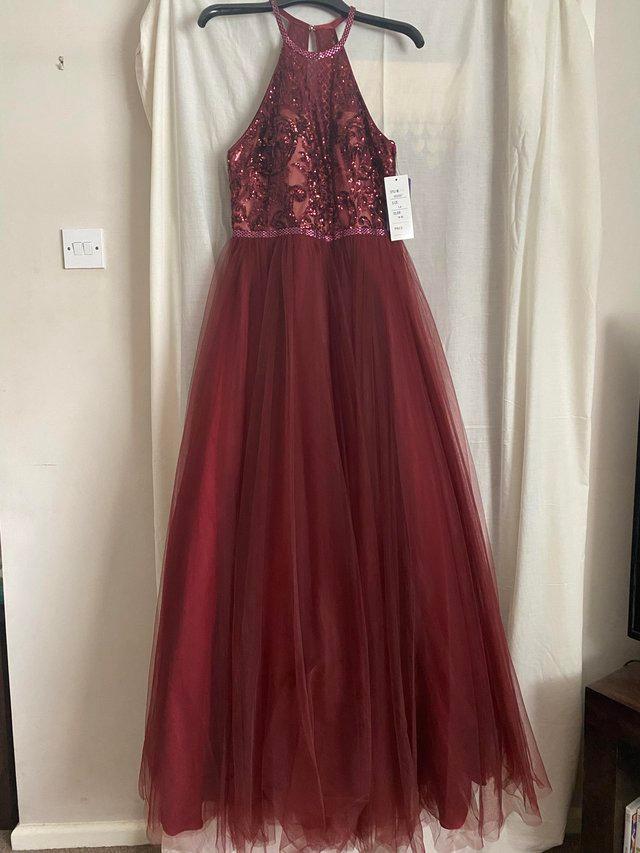 Preview of the first image of PROM DRESS - NEW WITH TAGS Burgundy full length.