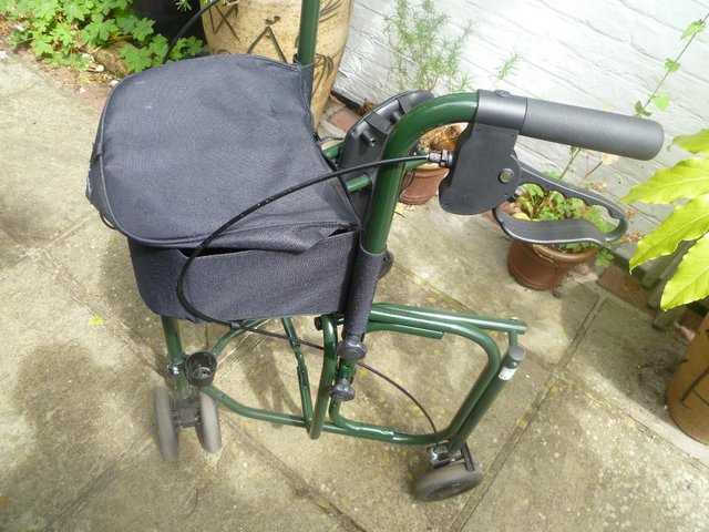 Preview of the first image of Uniscan Triumph Triangular Rollator in Green.