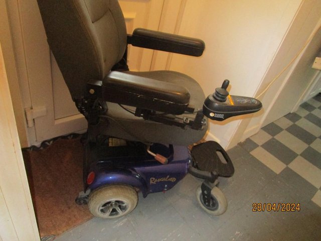 Preview of the first image of RASCAL  POWER CHAIR,  ELECTRIC,  GOOD CONDITION.