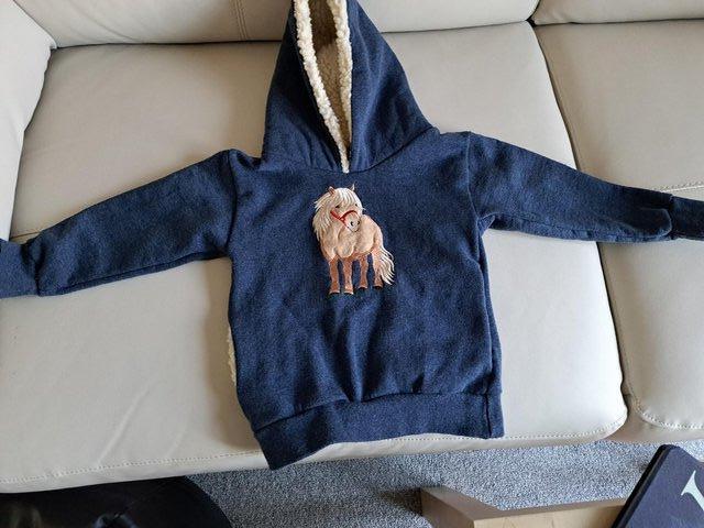 Preview of the first image of Childs Warm Hooded Sweat Tops age 1-2yrs.