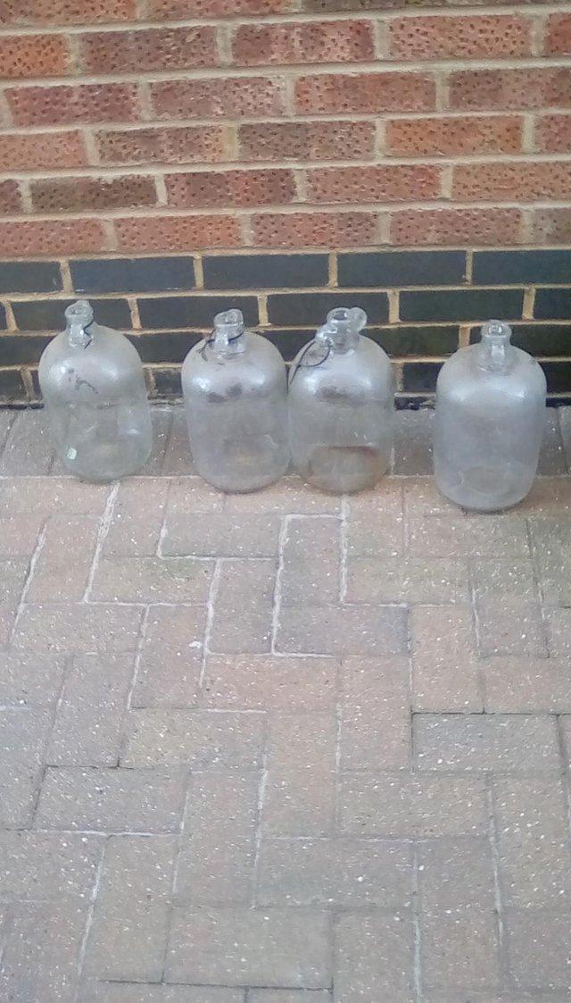 Preview of the first image of Set of four Demijohn's for wine making.
