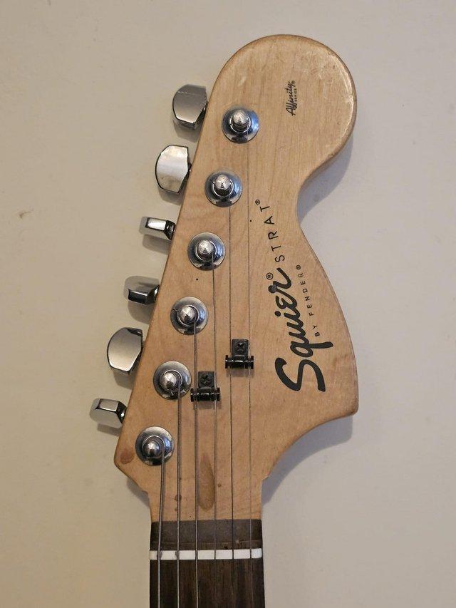 Preview of the first image of Vintage Fender strat/squire six string electric guitar.