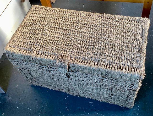 Preview of the first image of Lightweight wicker storage ottoman.
