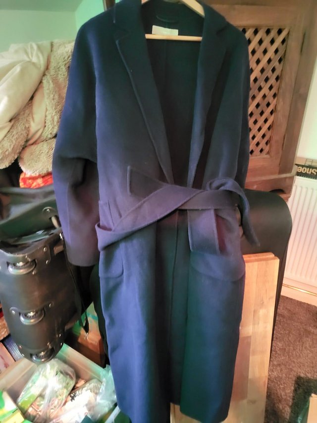 Preview of the first image of Xs-s 12 storeez coat for sale.