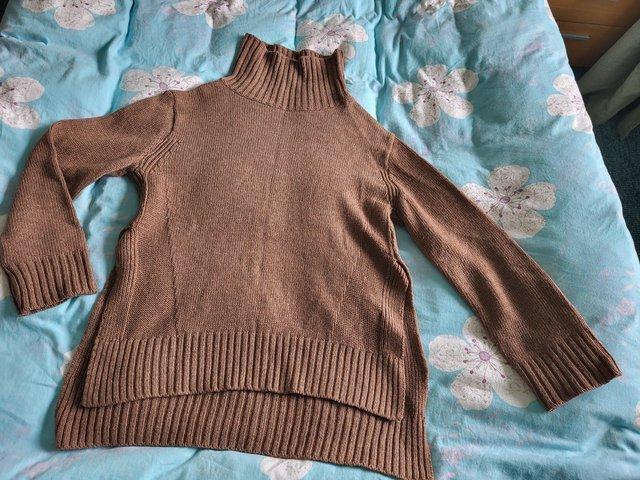 Preview of the first image of Women's Knit Roll Neck Split Jumper Brown Size M/L.