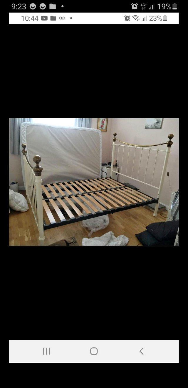 Preview of the first image of Dreams cast iron King size bed frame.