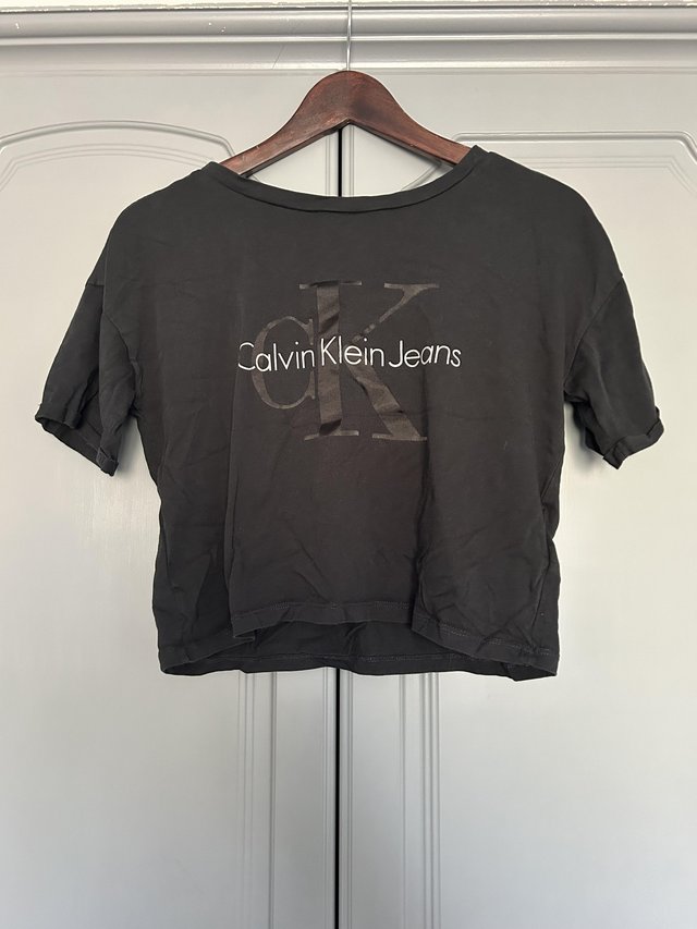 Preview of the first image of Calvin Klein Crop Top Black Size XS.
