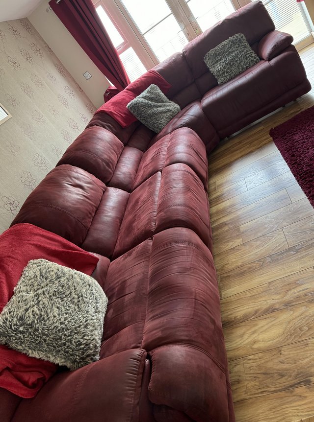 Preview of the first image of Corner sofa deep red high back ends recline.