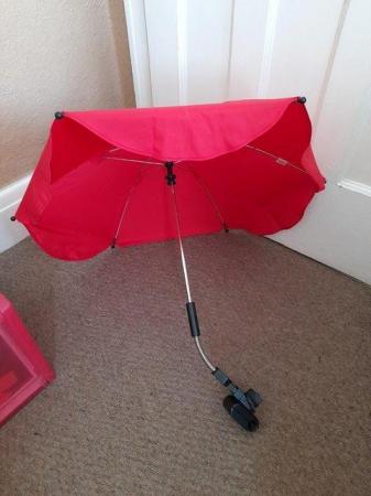 Image 1 of Red pushair parasol as new cond
