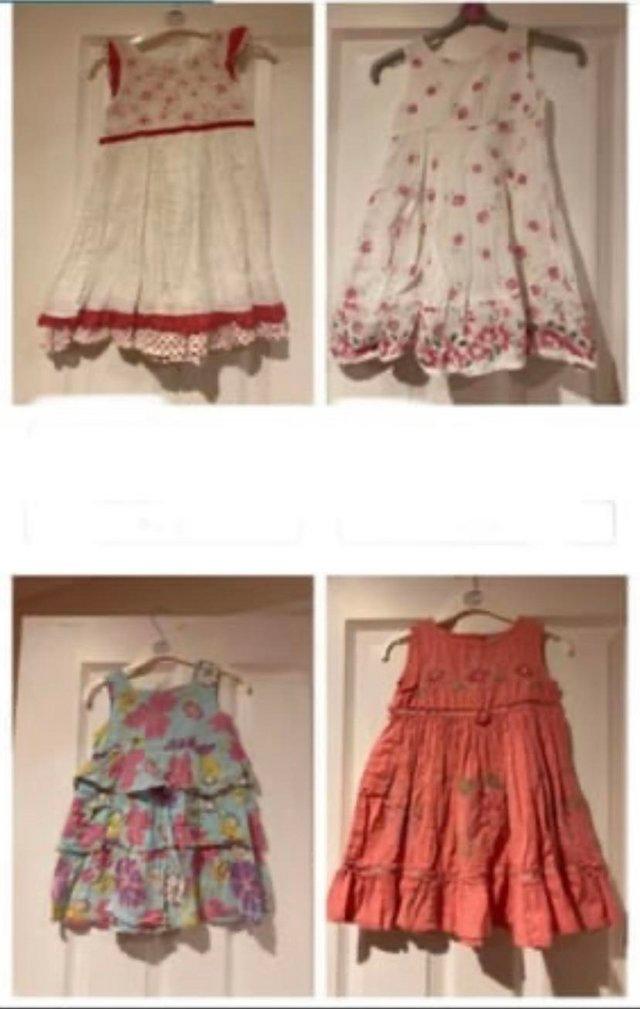 Preview of the first image of 4 toddlers dresses age 12-18 months.