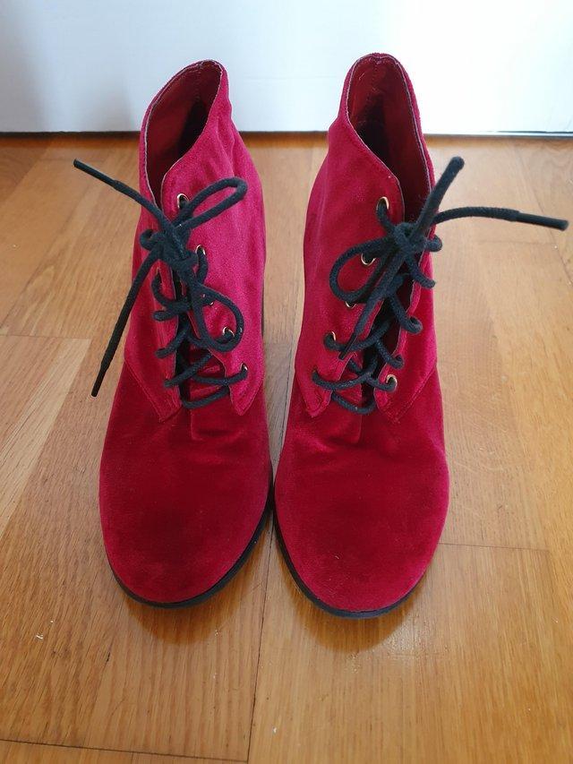 Preview of the first image of Womens size 5.5 to 6.5 red leather ankle boot.