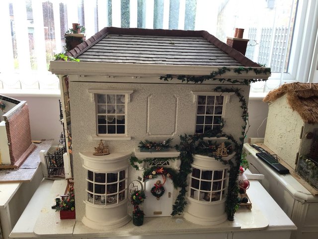 Preview of the first image of Christmas themed dolls house  with lights.