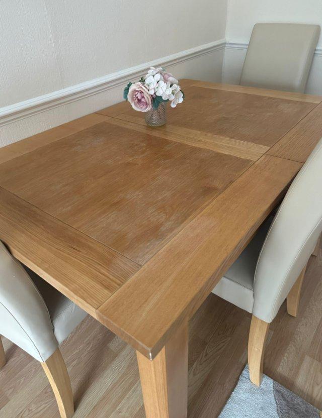 Preview of the first image of Dining table with 4 chairs for sale.