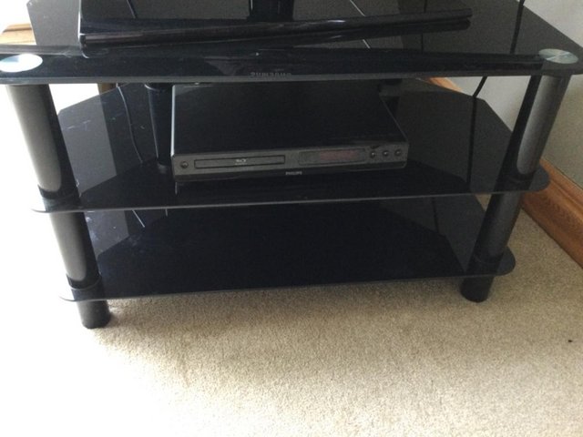 Preview of the first image of Black glass corner tv unit 2 shelves under.