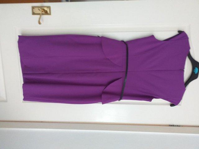 Preview of the first image of Ladies purple dress with peplum.
