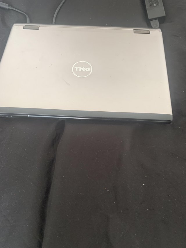 Preview of the first image of Dell laptop with original charger.