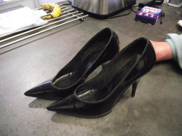 Image 1 of A pare of black patent leather high heels