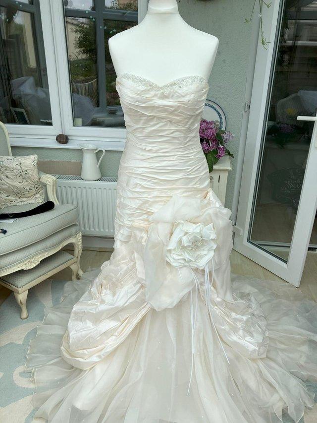 Preview of the first image of Wedding Dress by designer Ian Stuart size 12.