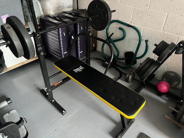 Preview of the first image of Weight bench and weights.