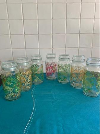 Image 1 of Nine pretty floral storage jars