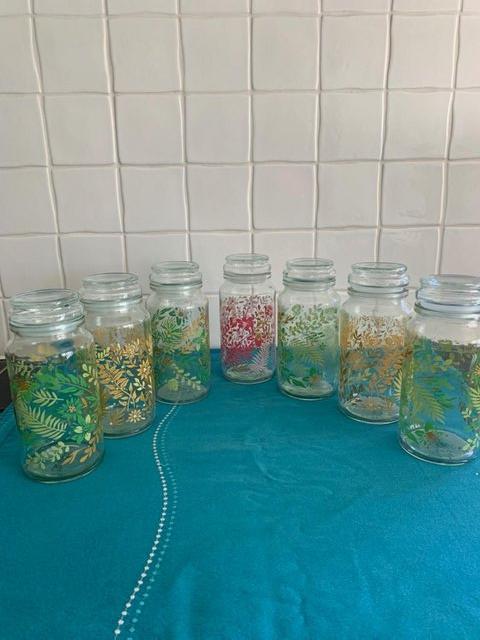 Preview of the first image of Nine pretty floral storage jars.