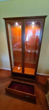 Image 1 of Beautiful tall wood and glass display cabinet with light