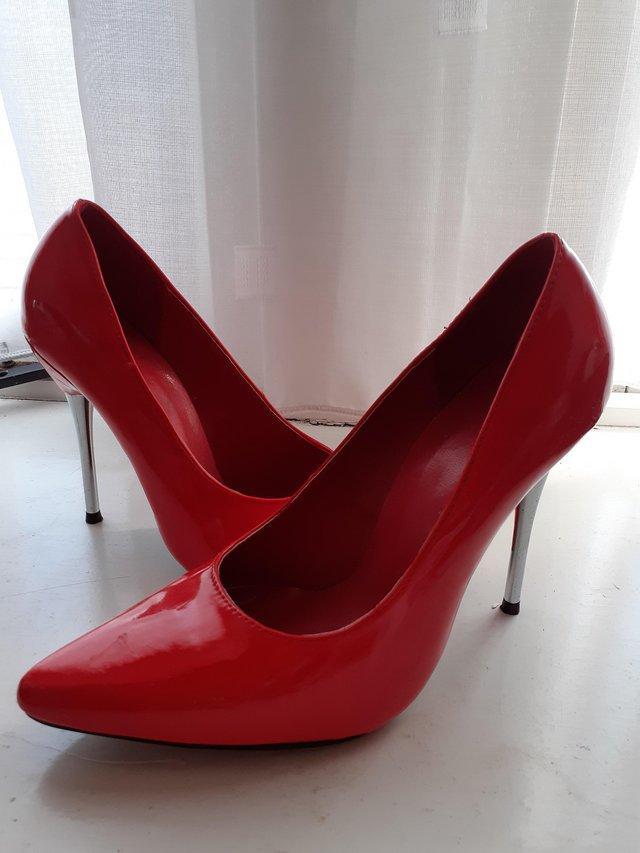 Preview of the first image of Red Court Shoes size 4 gold heels.