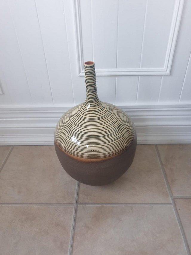 Preview of the first image of Large Vase with Long Neck Brown in colour spirals on neck.
