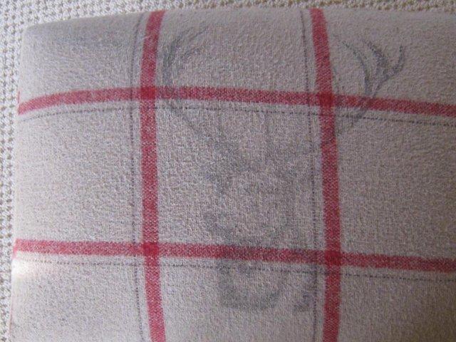 Preview of the first image of Footstool in a chequered cloth.