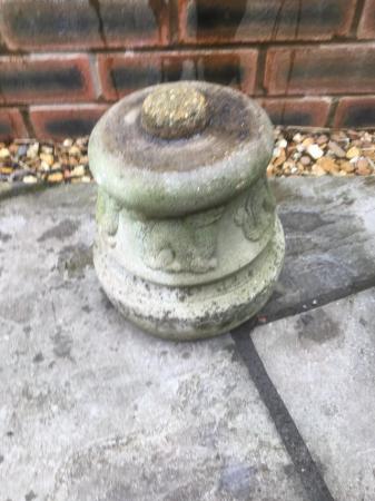Image 1 of A two piece round concrete garden planter with animal design
