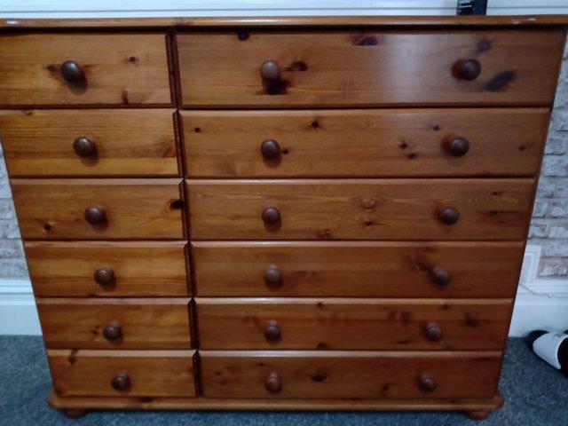 Preview of the first image of Antique pine 12 chest of drawers for sale.