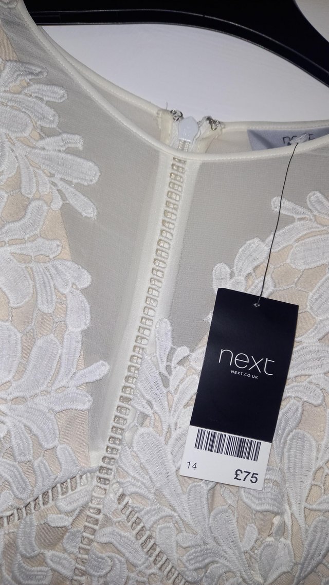 Preview of the first image of Next cream dress, tags still attached..