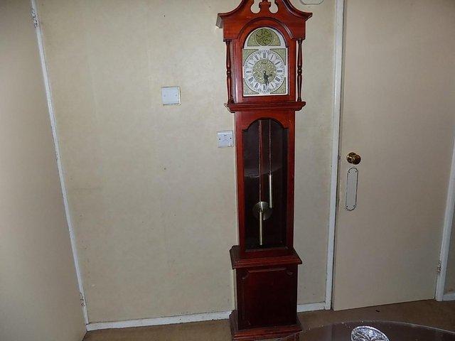 Preview of the first image of Grandfather Clock in Mahogany Clean Condition.