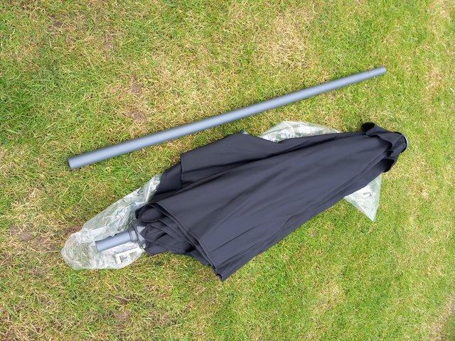 Preview of the first image of Black Garden parasol with crank, in excellent condition.