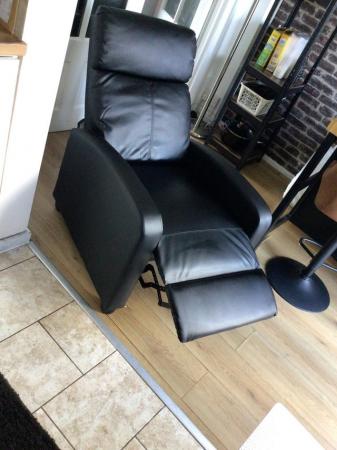 Image 1 of Black recliner armchair for sale.