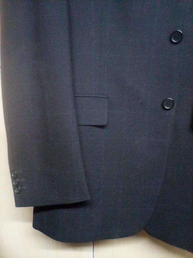 Preview of the first image of Marks & Spencer brand new and unworn Men's suit with 2 pairs.