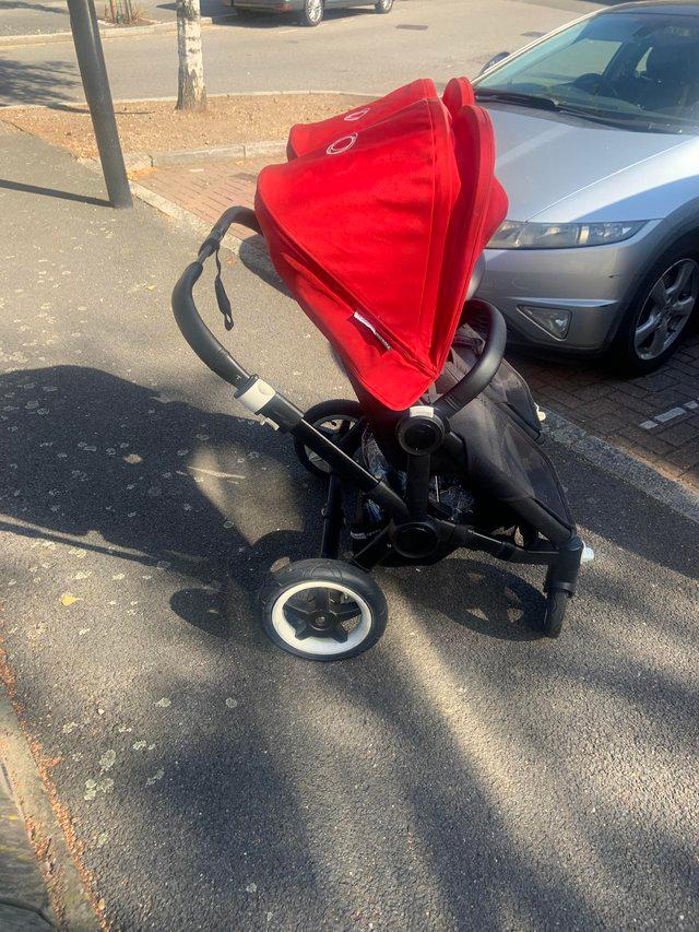 Preview of the first image of Pre-used Bugaboo Donkey in bugaboo red.