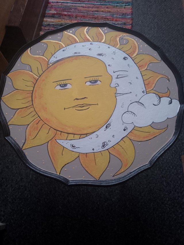 Preview of the first image of Hand painted table in sun design. Four legged.