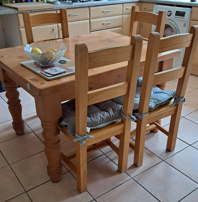 Preview of the first image of Solid wooden table with 4 chairs.