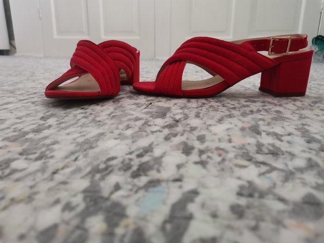 Preview of the first image of Red herring size 5 small heel red sling backs.