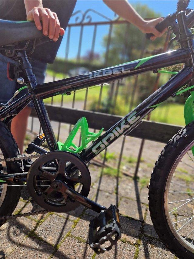 Preview of the first image of Children's mountain bike black and green.