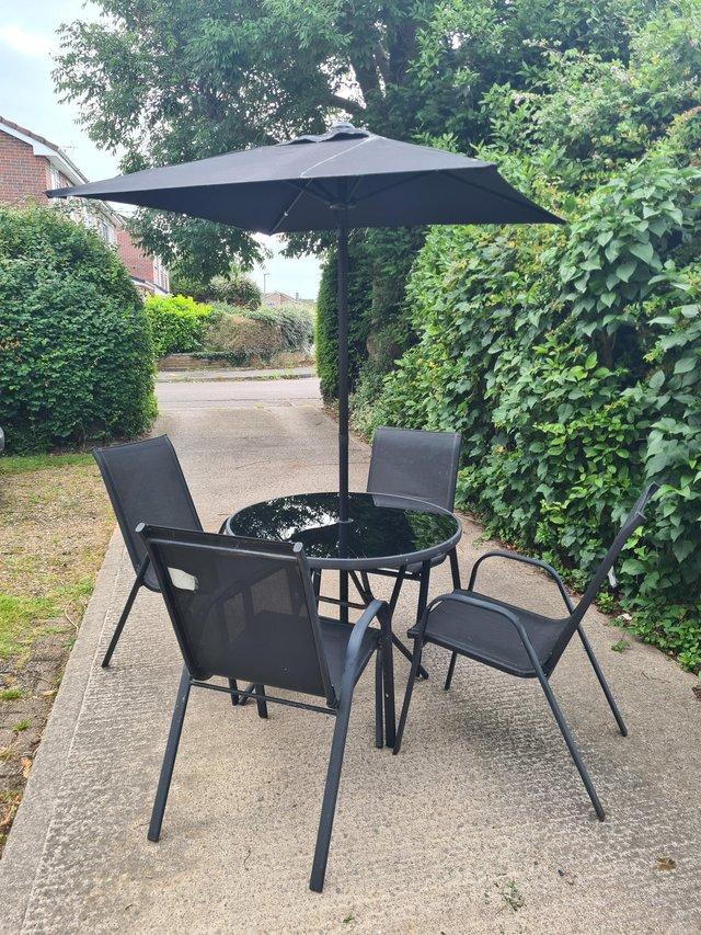 Preview of the first image of Garden Table, Chairs & Parasol.