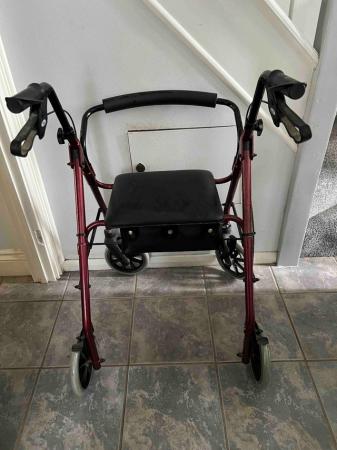 Image 1 of Walking aid with four wheels, brakes and seat