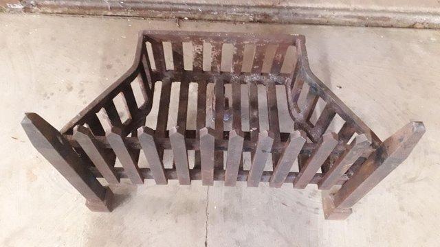 Preview of the first image of Heavy cast iron fire grate excellent condition.